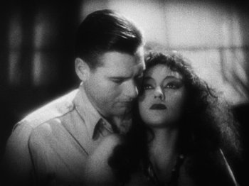 Movie still from “Island of Lost Souls” (1932), directed by Erle C. Kenton – A man and a woman standing next to each other; Close Up shot, High angle