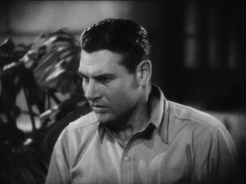 Movie still from “Island of Lost Souls” (1932), directed by Erle C. Kenton – A man in a brown shirt is looking at the camera; Close Up shot, Low angle
