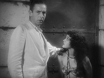 Movie still from “Island of Lost Souls” (1932), directed by Erle C. Kenton – A man and a woman are standing next to each other; Medium shot, Over the shoulder angle