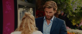 Movie still from “Isn't It Romantic” (2019), directed by Todd Strauss-Schulson – A man and a woman are standing together; Close Up shot, Over the shoulder angle