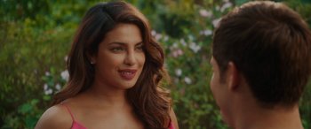 Movie still from “Isn't It Romantic” (2019), directed by Todd Strauss-Schulson – A person wearing a red shirt; Close Up shot, Over the shoulder angle