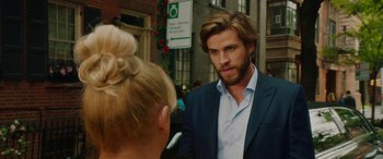 Movie still from “Isn't It Romantic” (2019), directed by Todd Strauss-Schulson – A man and a woman are standing in front of each other; Close Up shot, Over the shoulder angle