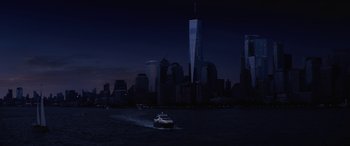 Movie still from “Isn't It Romantic” (2019), directed by Todd Strauss-Schulson – A boat in the middle of the night in front of a city skyline; Extreme Wide shot, High angle