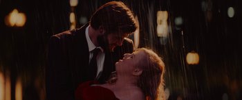 Movie still from “Isn't It Romantic” (2019), directed by Todd Strauss-Schulson – A man and a woman in the rain; Medium shot, Low angle