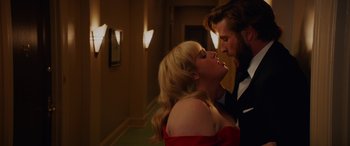 Movie still from “Isn't It Romantic” (2019), directed by Todd Strauss-Schulson – A man and a woman kissing in a hallway; Close Up shot, Over the shoulder angle