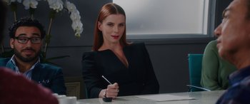 Movie still from “Isn't It Romantic” (2019), directed by Todd Strauss-Schulson – A woman sitting at a table writing on a piece of paper; Close Up shot, Over the shoulder angle