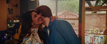 Movie still from “Isn't It Romantic” (2019), directed by Todd Strauss-Schulson – A man and a woman kissing each other outside; Close Up shot, Over the shoulder angle