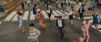 Movie still from “Isn't It Romantic” (2019), directed by Todd Strauss-Schulson – A group of people walking across a crosswalk; Extreme Wide shot, High angle