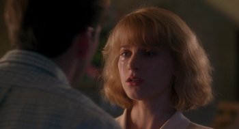 Movie still from “It Could Happen to You” (1994), directed by Andrew Bergman – A person looking at the camera; Close Up shot, Over the shoulder angle