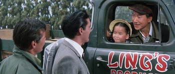 Movie still from “It Happened at the World's Fair” (1963), directed by Norman Taurog – A man and a little girl looking out of the window of a truck; Close Up shot, Over the shoulder angle