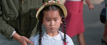 Movie still from “It Happened at the World's Fair” (1963), directed by Norman Taurog – A little girl wearing a straw hat with cherries on it; Close Up shot, High angle