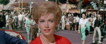 Movie still from “It Happened at the World's Fair” (1963), directed by Norman Taurog – A person wearing a red shirt; Close Up shot, Low angle
