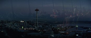 Movie still from “It Happened at the World's Fair” (1963), directed by Norman Taurog – A group of people sitting at a table in front of the space needle; Extreme Wide shot, High angle