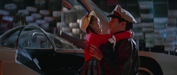 Movie still from “It Happened at the World's Fair” (1963), directed by Norman Taurog – A man holding a little girl in his arms; Medium shot, Over the shoulder angle