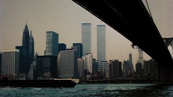 Movie still from “It Might Get Loud” (2008), directed by Davis Guggenheim – A view of a city skyline from a boat; Extreme Wide shot, Low angle
