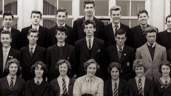 Movie still from “It Might Get Loud” (2008), directed by Davis Guggenheim – A group of people in suits and ties; Wide shot, Overhead angle