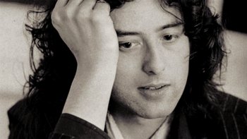 Movie still from “It Might Get Loud” (2008), directed by Davis Guggenheim – Black and white photograph of a young man holding his hand up to his head; Close Up shot, High angle
