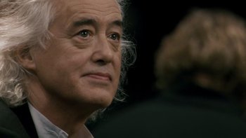 Movie still from “It Might Get Loud” (2008), directed by Davis Guggenheim – An older man is looking into the distance; Close Up shot, Over the shoulder angle