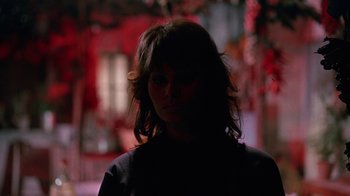 Movie still from “It Started in Naples” (1960), directed by Melville Shavelson – A woman with long dark hair standing in the dark; Close Up shot, Low angle