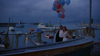 Movie still from “It Started in Naples” (1960), directed by Melville Shavelson – A man and a woman standing next to each other on a boat; Wide shot, Low angle