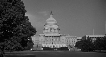 Movie still from “It! The Terror from Beyond Space” (1958), directed by Edward L. Cahn – A black and white photo of the capitol building; Extreme Wide shot, Low angle