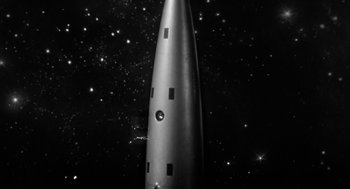 Movie still from “It! The Terror from Beyond Space” (1958), directed by Edward L. Cahn – A black - and - white photo of a space ship; Extreme Close Up shot, Low angle