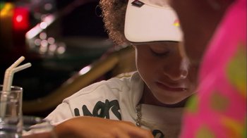 Movie still from “It's All Gone Pete Tong” (2004), directed by Michael Dowse – A person wearing a hat; Close Up shot, High angle