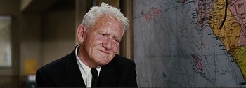 Movie still from “It's a Mad Mad Mad Mad World” (1963), directed by Stanley Kramer – An older man in a suit and white hair; Close Up shot, Low angle