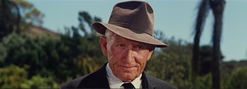 Movie still from “It's a Mad Mad Mad Mad World” (1963), directed by Stanley Kramer – An older man wearing a hat and a suit; Close Up shot, Low angle