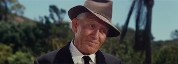 Movie still from “It's a Mad Mad Mad Mad World” (1963), directed by Stanley Kramer – An older man wearing a hat and a suit; Close Up shot, Low angle