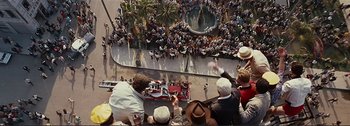Movie still from “It's a Mad Mad Mad Mad World” (1963), directed by Stanley Kramer – A group of people standing on top of a building; Extreme Wide shot, Overhead angle