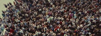 Movie still from “It's a Mad Mad Mad Mad World” (1963), directed by Stanley Kramer – An overhead view of a crowd of people sitting in a stadium; Extreme Wide shot, Overhead angle