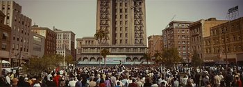 Movie still from “It's a Mad Mad Mad Mad World” (1963), directed by Stanley Kramer – A crowd of people gathered in front of a tall building; Extreme Wide shot, High angle