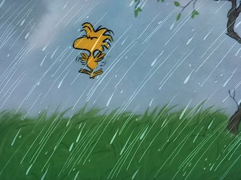Movie still from “It's the Easter Beagle, Charlie Brown!” (1974), directed by Phil Roman – A drawing of a dog jumping in the air in the rain; Extreme Wide shot, Low angle