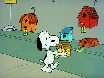 Movie still from “It's the Easter Beagle, Charlie Brown!” (1974), directed by Phil Roman – A cartoon of a dog standing in front of birdhouses; Extreme Wide shot, Low angle