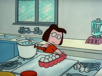 Movie still from “It's the Easter Beagle, Charlie Brown!” (1974), directed by Phil Roman – A cartoon of a woman making eggs in a kitchen; Medium shot, High angle