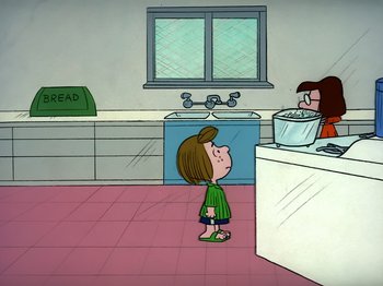 Movie still from “It's the Easter Beagle, Charlie Brown!” (1974), directed by Phil Roman – A girl standing in front of a sink in a kitchen; Extreme Wide shot, High angle