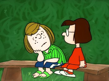 Movie still from “It's the Easter Beagle, Charlie Brown!” (1974), directed by Phil Roman – A cartoon of a girl sitting on the ground next to another girl; Medium shot, High angle