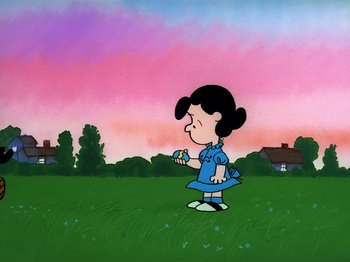 Movie still from “It's the Easter Beagle, Charlie Brown!” (1974), directed by Phil Roman – A cartoon of a girl in a blue dress holding a flower; Extreme Wide shot, High angle