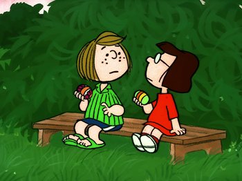 Movie still from “It's the Easter Beagle, Charlie Brown!” (1974), directed by Phil Roman – A couple of people sitting on top of a wooden bench; Medium shot, High angle