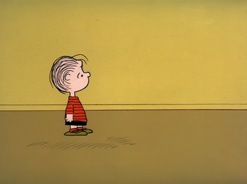 Movie still from “It's the Easter Beagle, Charlie Brown!” (1974), directed by Phil Roman – A drawing of a charlie brown character standing in front of a yellow wall; Extreme Wide shot, High angle