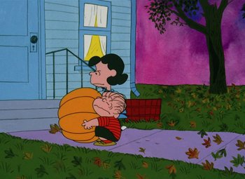 Movie still from “It's the Great Pumpkin, Charlie Brown” (1966), directed by Bill Melendez – A painting of a woman holding a giant pumpkin in front of a house; Extreme Wide shot, High angle