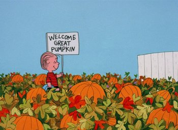 Movie still from “It's the Great Pumpkin, Charlie Brown” (1966), directed by Bill Melendez – A charlie brown holding a welcome great pumpkin sign; Extreme Wide shot, High angle