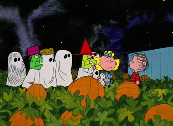 Movie still from “It's the Great Pumpkin, Charlie Brown” (1966), directed by Bill Melendez – A group of cartoon characters sitting in a pumpkin patch; Extreme Wide shot, High angle