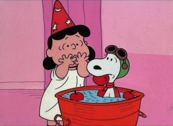 Movie still from “It's the Great Pumpkin, Charlie Brown” (1966), directed by Bill Melendez – A cartoon of a woman and a dog in a tub; Extreme Wide shot, High angle