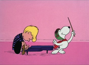 Movie still from “It's the Great Pumpkin, Charlie Brown” (1966), directed by Bill Melendez – A drawing of a boy and a dog playing a musical instrument together; Extreme Wide shot, High angle