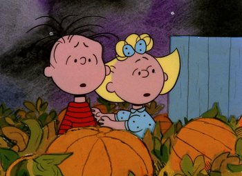 Movie still from “It's the Great Pumpkin, Charlie Brown” (1966), directed by Bill Melendez – A couple of people standing next to each other in a pumpkin patch; Medium shot, High angle