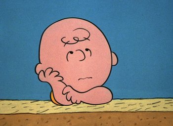 Movie still from “It's the Great Pumpkin, Charlie Brown” (1966), directed by Bill Melendez – A drawing of a baby sitting on the ground; Close Up shot, High angle