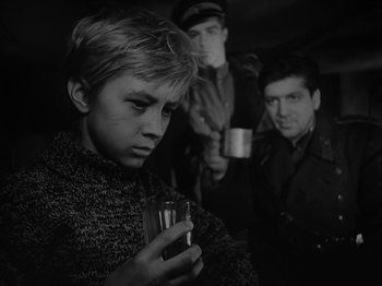 Movie still from “Ivan's Childhood” (1962), directed by Eduard Abalov – A group of men standing next to each other holding cups; Close Up shot, Low angle
