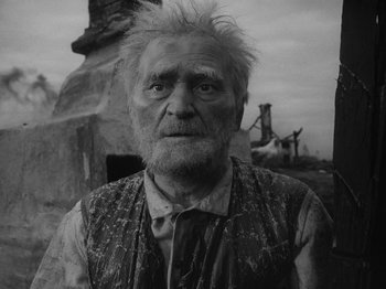 Movie still from “Ivan's Childhood” (1962), directed by Eduard Abalov – An old man with a white beard and a black tie; Close Up shot, Low angle